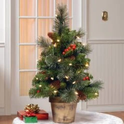 2ft. Pre-Lit Crestwood Spruce Small Tree With Silver Bristle, Cones, Red Berries & Glitter In A Plastic Bronze Pot, Clear Lights -Northlight Decor Store D206316S 2