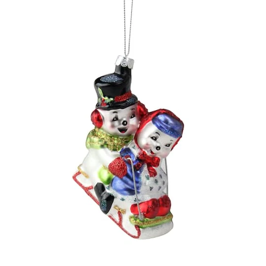 Northlight 4.5" White & Red Cheerful Sledding Snowmen Couple Glass Christmas Ornament 4 Northlight 4.5" White & Red Cheerful Sledding Snowmen Couple Glass Christmas Ornament - Image 4